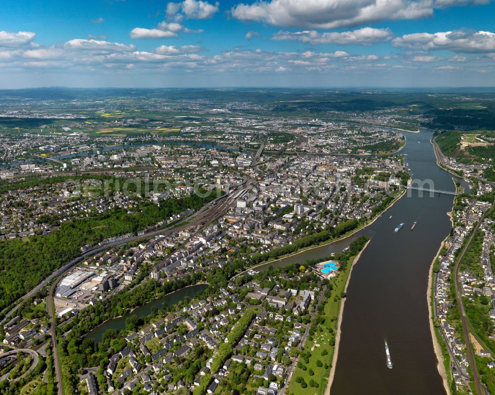 Koblenz from above - The river Rhine in Koblenz in the state of Rhineland-Palatinate. The metropolitan area of Koblenz is one of the oldest cities in Germany. Parts of Koblenz belong to the UNESCO world heritage. The river separates the city. Bridges, ships and small islands mark the run of the river in the area