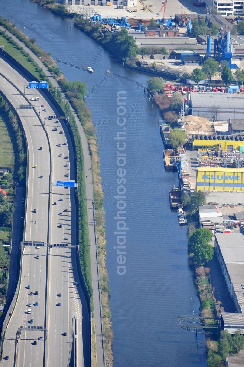 Berlin from the bird's eye view: The course of the E35 motorway / A113 along the Teltow canal at the Ernst-Ruska-Ufer in Berlin Adlershof. The newly built highway runs along the former border / border strip between Adlershof and Rudow