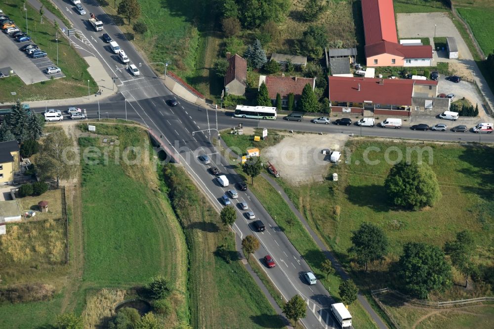 Lindenberg from the bird's eye view: Road over the crossroads der B2, Bucher Weg und Bernauer Strasse in Lindenberg in the state Brandenburg