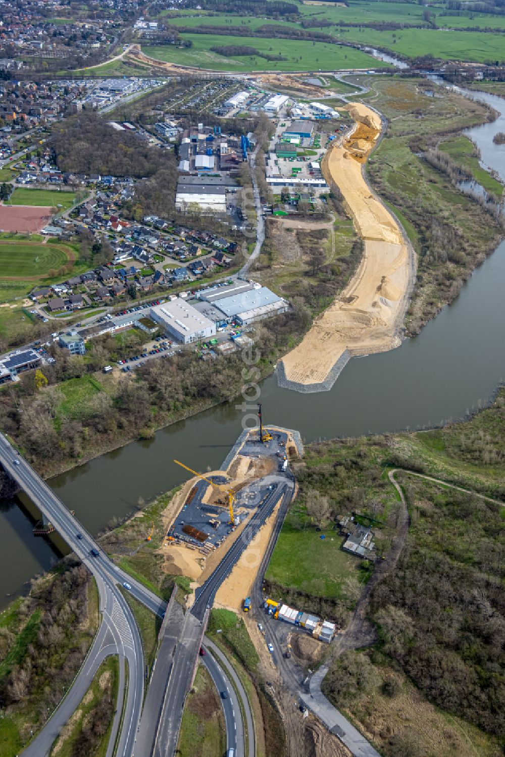 Wesel from the bird's eye view: Construction site with earthworks for relocation, relocation and redesign of the shore areas along the mouth of the river Lippe in Wesel in the Ruhr area in the state of North Rhine-Westphalia, Germany