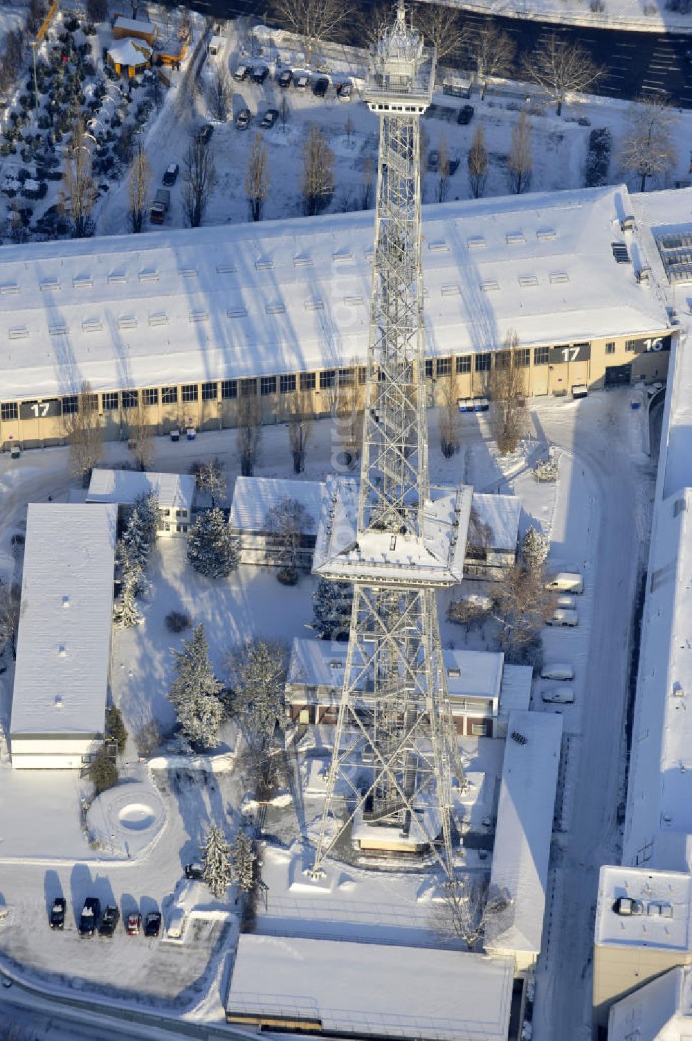 Berlin from above - Der winterlich Blick auf das verschneite Areal des Funkturm / ICC im Messegelände in Berlin Charlottenburg. The winter view of the snow area of the radio tower / ICC in the Exhibition Grounds in Berlin Charlottenburg.