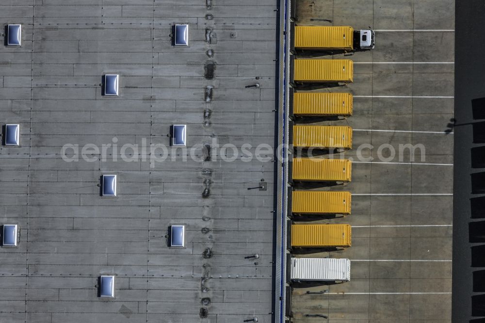 Neumarkt in der Oberpfalz from above - Distribution centre with yellow trucks in Neumarkt in der Oberpfalz in the state of Bavaria. The logistics centre is located in the commercial area of Haberslehla in the North of Neumarkt. The yellow trucks are standing in a symmetrical row next to the big hall