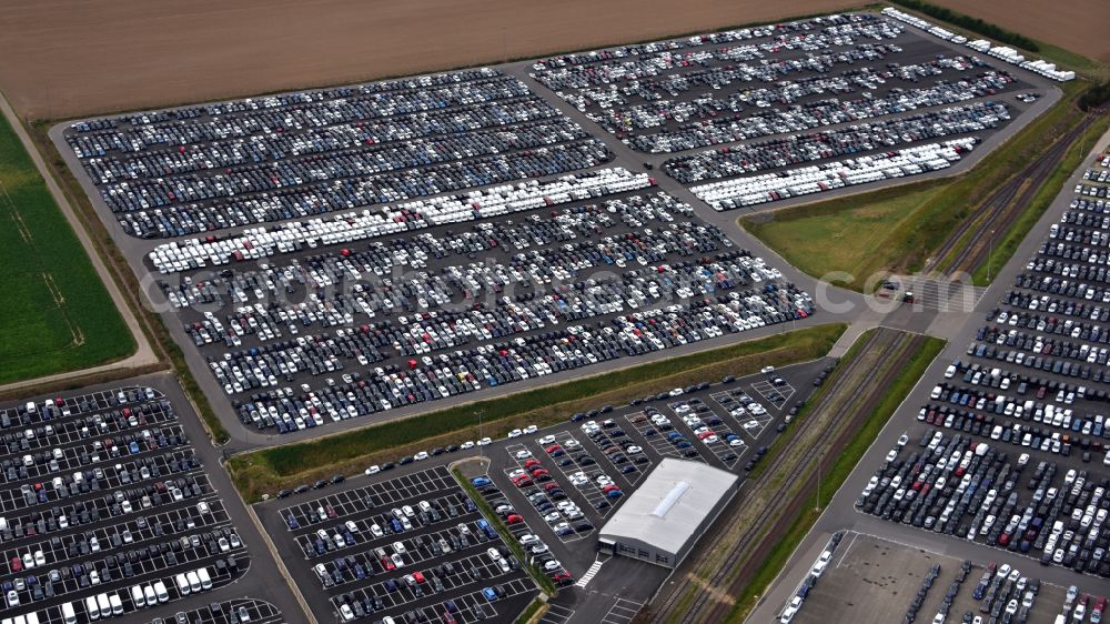 Aerial image Zülpich - of the building complex of the distribution center and logistics center for new cars and new vehicles on the premises of CAT Germany GmbH on the B56 road in the district of Geich in Zuelpich in the state of North Rhine-Westphalia, Germany