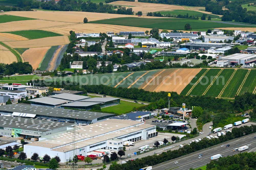 Ilsfeld from the bird's eye view: Building complex of the distribution center and food logistics center on the premises of HAVI Logistics on Porschestrasse in the Auenstein district of Ilsfeld in the state of Baden-Wuerttemberg, Germany