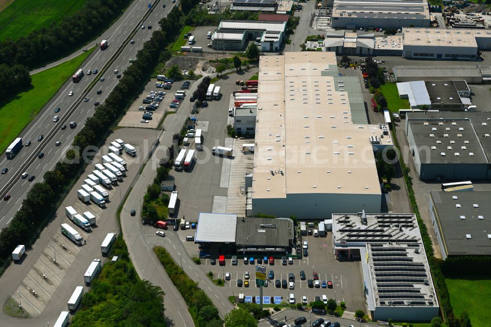 Aerial photograph Ilsfeld - Building complex of the distribution center and food logistics center on the premises of HAVI Logistics on Porschestrasse in the Auenstein district of Ilsfeld in the state of Baden-Wuerttemberg, Germany