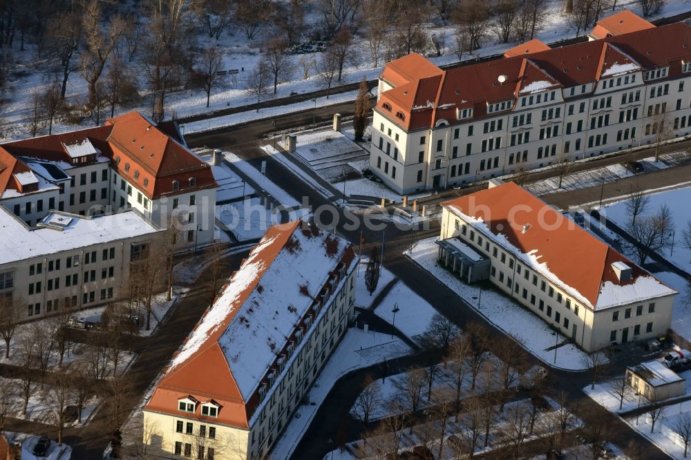 Magdeburg from the bird's eye view: Winterly snowy administrative buildings of the state authority Kultusministerium des Landes Sachsen-Anhalt besides the roads Turmschanzenstrasse and Biederitzer Weg in Magdeburg in the state Saxony-Anhalt