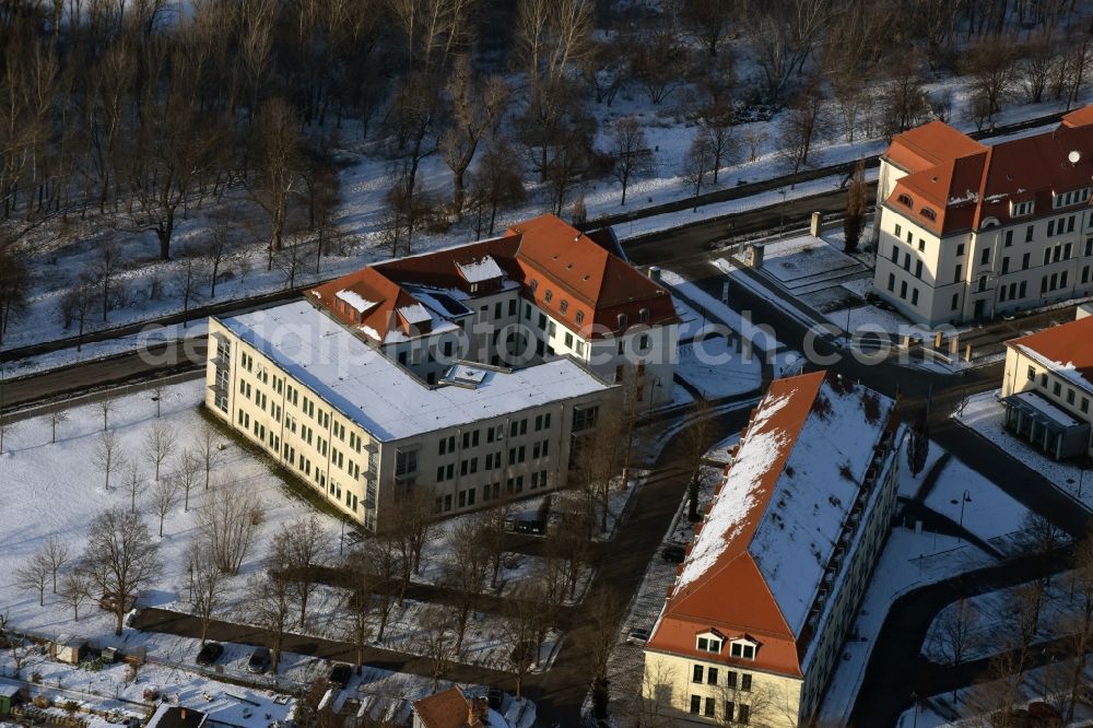 Aerial photograph Magdeburg - Winterly snowy administrative buildings of the state authority Kultusministerium des Landes Sachsen-Anhalt besides the roads Turmschanzenstrasse and Biederitzer Weg in Magdeburg in the state Saxony-Anhalt