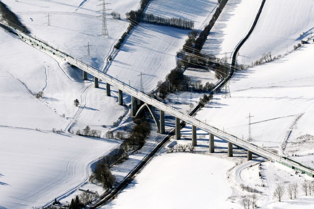 Wolfsberg from above - Wintry snowy viaduct of the railway bridge structure to route the railway tracks in Graefinau-Angstedt in the state Thuringia