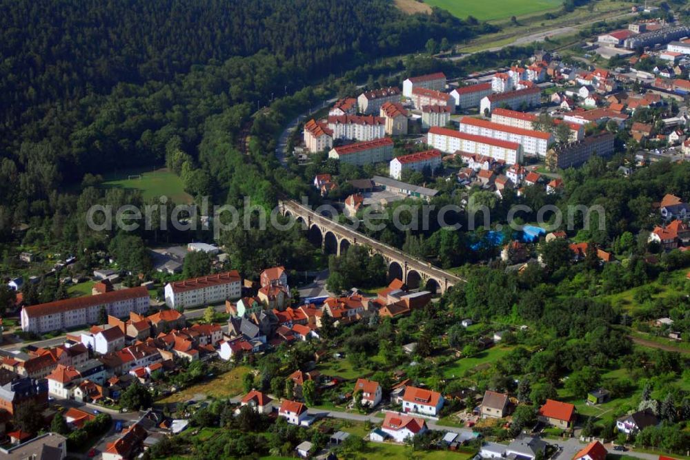 Aerial photograph Stadtilm - Blick auf das Viadukt über das Ilmtal in Stadtilm. Ein auffälliges und sehenswertes Bauwerk stellt das nebenstehende Viadukt dar. Es wurde 1891 bis 1893 erbaut. Das 13 -bögige Eisenbahnviadukt überspannt das Ilmtal in einer Länge von 202 m und hat eine Höhe von 18 m.