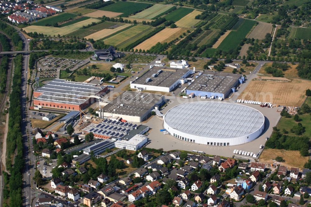 Weil am Rhein from the bird's eye view: The Vitra Campus in Weil am Rhein in the state of Baden-Wuerttemberg combines numerous buildings by world-renowned architects. The production site of the chair and furniture manufacturer is the contact point for design and architecture lovers from around the world