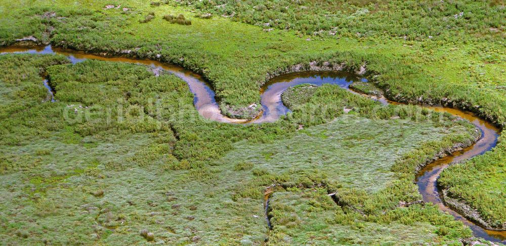 Aerial photograph 08.07.2008 - Blick auf die Vogelinsel im Becken von Arcachon. Ihren Namen verdankt sie den zahlreichen Wasservögeln, denen sie zur Rast und Futtersuche dient. In dem Naturschutzgebiet sind lediglich 4 Hüttendörfer zu finden. Die Küsten der Inseln werden wie im gesamten Becken für die Austernzucht genutzt, die hier durch Ebbe und Flut ermöglicht wird. View at the bird island in theBay of Arcachon. It has its name from the many water birds, which use the place to rest and forage. In the nature reserve only 4 hut villages are located. The shores of the island are used as in the whole basin for the cultivation of oysters, which is made possible by the tides.