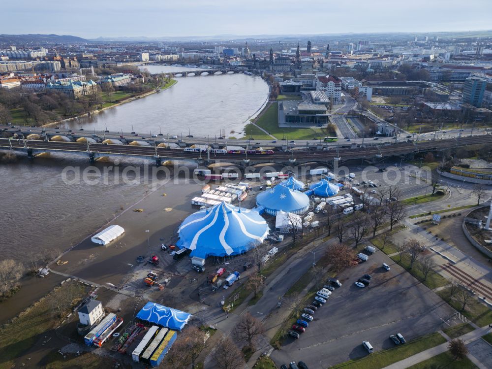 Aerial image Dresden - Christmas circus with Elbe flood on the folk festival grounds at Pieschener Allee in the district of Friedrichstadt in Dresden in the federal state of Saxony, Germany