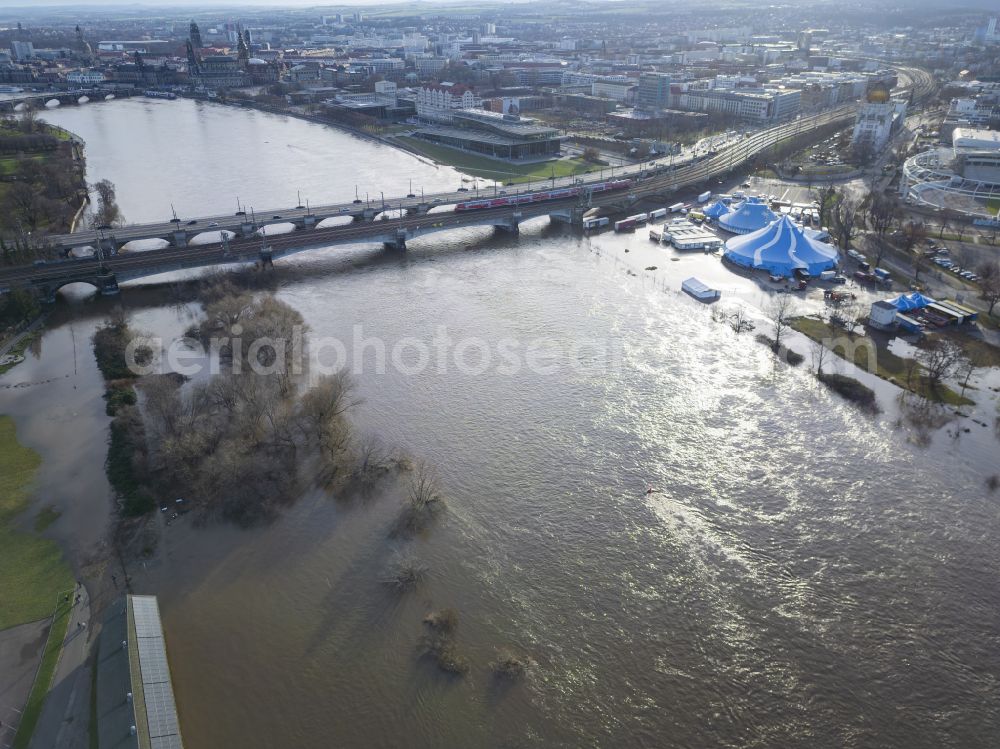 Dresden from the bird's eye view: Christmas circus with Elbe flood on the folk festival grounds at Pieschener Allee in the district of Friedrichstadt in Dresden in the federal state of Saxony, Germany