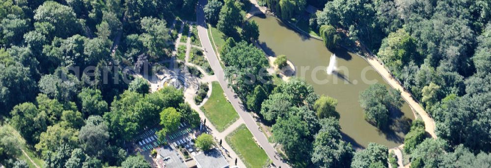 Berlin Friedrichshain from the bird's eye view: Blick auf den Volkspark Friedrichshain im gleichnamigen Stadtbezirk. Der Friedrichshain ist die erste kommunale Parkanlage Berlins. Herausragende Sehenswürdigkeit ist der Märchenbrunnen und der Kleine (48 m) und der Große Bunkerberg (Mont Klamott, 78 m), beide haben eine Aussichtsplattform. View of the People's Park in the same city district of Friedrichshain.