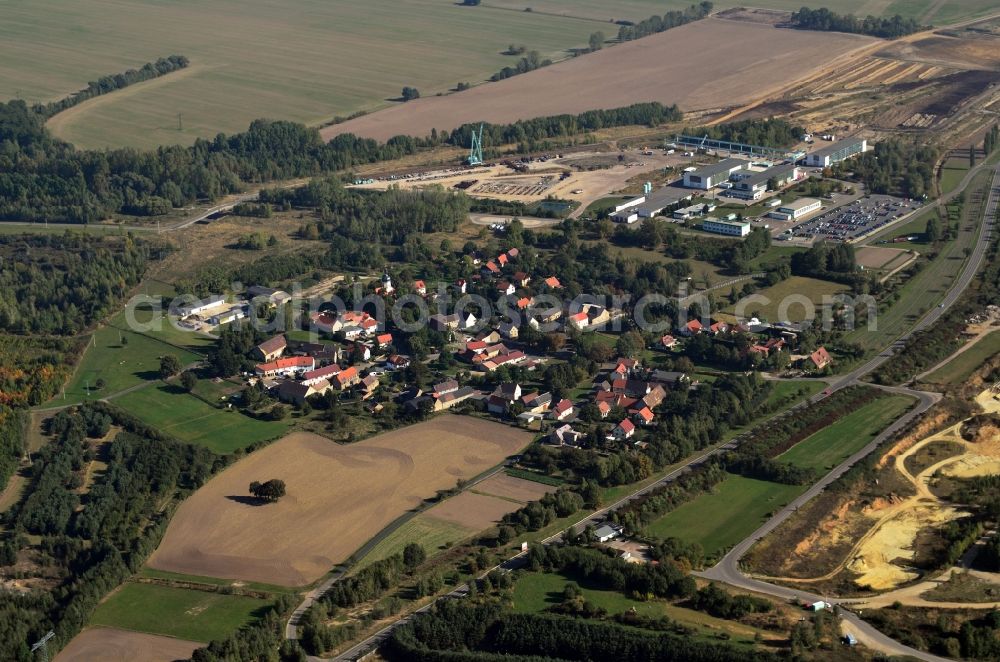 Pödelwitz from the bird's eye view: View of the village Poedelwitz at the coal mine Schleenhain in the state Saxony