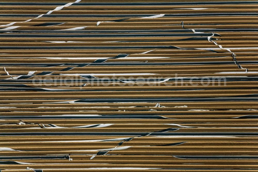 Aerial photograph Kühbach - The wind blew foil cover on a growing asparagus field in Kuehbach in Bavaria