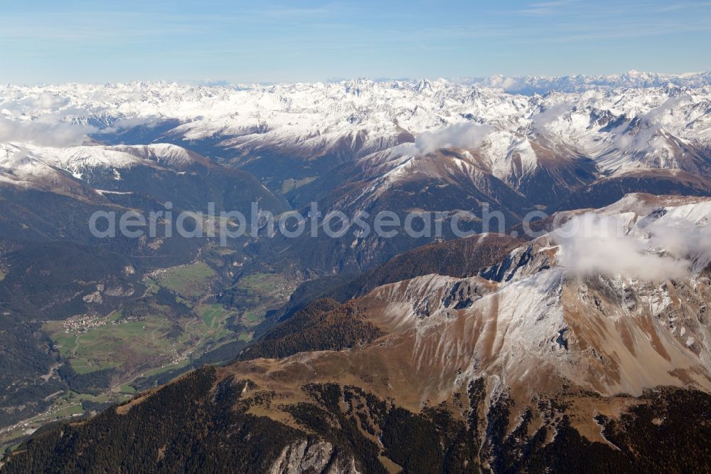 Aerial image Albula/Alvra - Snow covered mountains in the Swiss Alps and landscape in the valley at Albula and Filisur in the canton Grisons, Switzerland