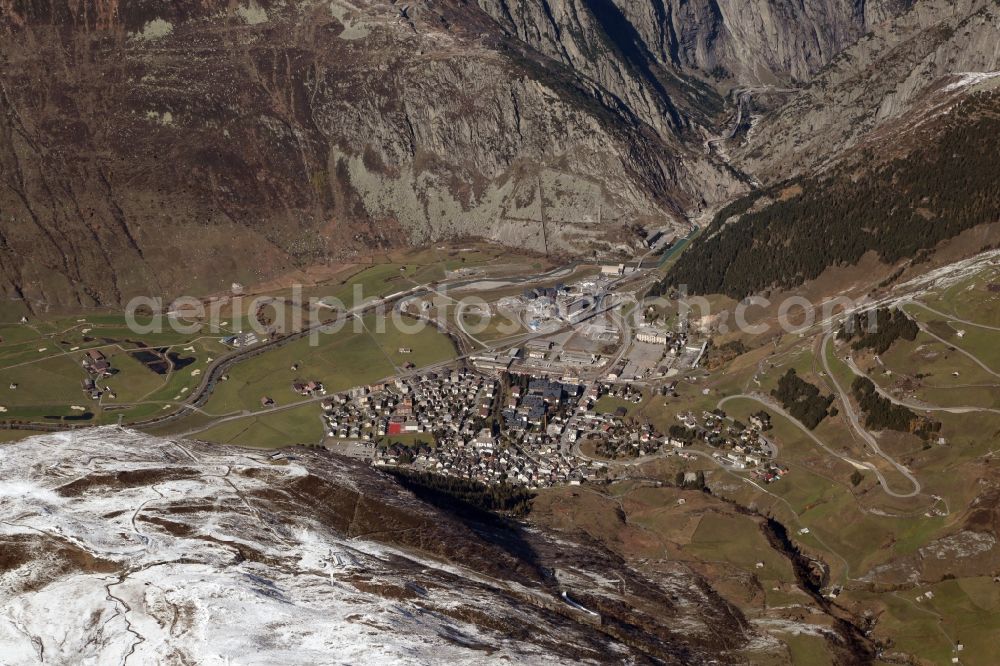 Aerial image Andermatt - Valley landscape surrounded by mountains in Andermatt in the canton Uri, Switzerland