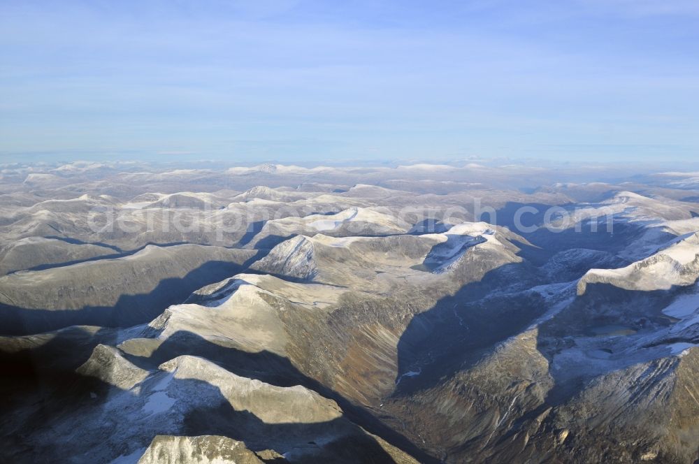 Aerial photograph Stranda - Landscape with mountain tops covered with ice in the national park Reinheimen near Stranda in Norway. The nature reserve in the mountains of the province of More og Romsdal was declared a national park in 2006 to protect and explore the ecosystem of the high mountains