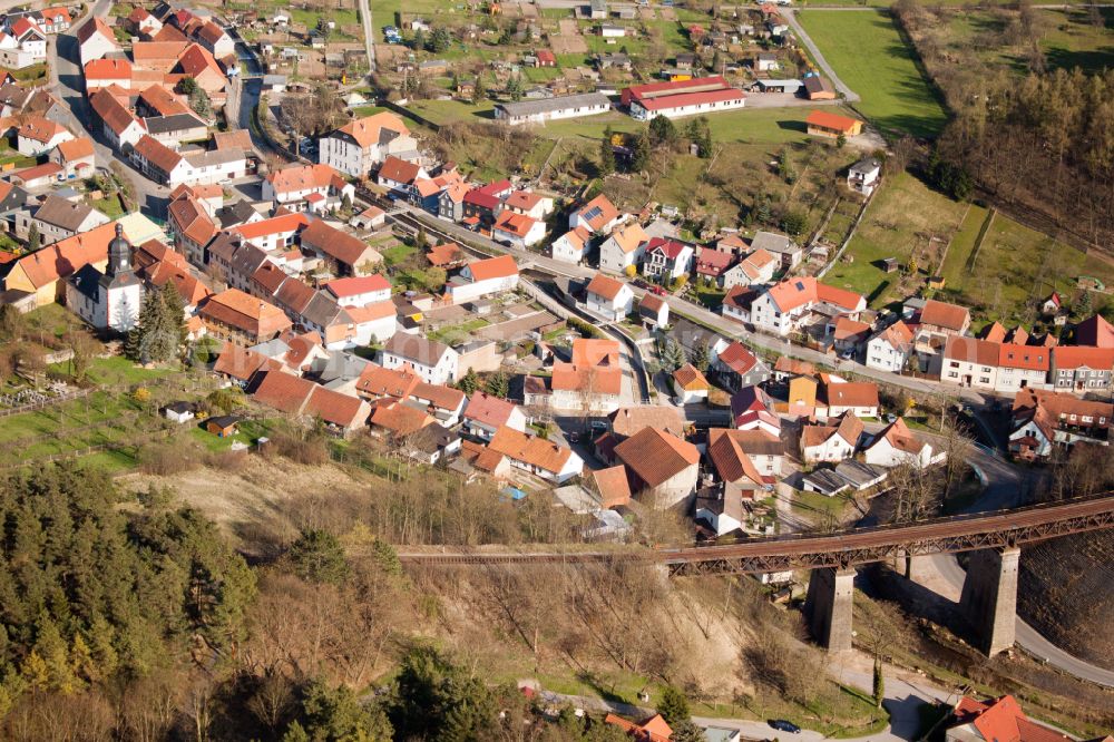 Angelroda from the bird's eye view: Surrounded by forest and forest areas center of the streets and houses and residential areas in Angelroda in the state Thuringia, Germany