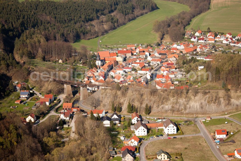 Angelroda from the bird's eye view: Surrounded by forest and forest areas center of the streets and houses and residential areas in Angelroda in the state Thuringia, Germany