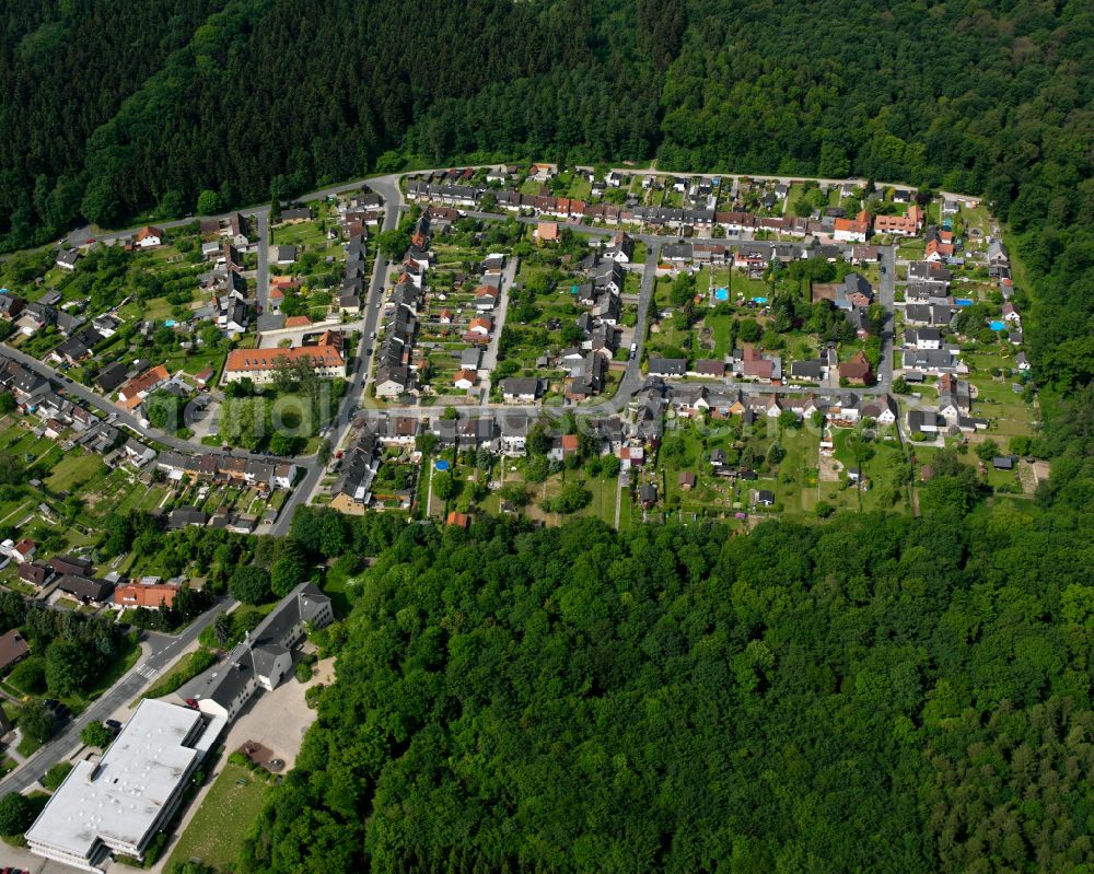 Bad from above - Surrounded by forest and forest areas center of the streets and houses and residential areas in Bad in the state Lower Saxony, Germany