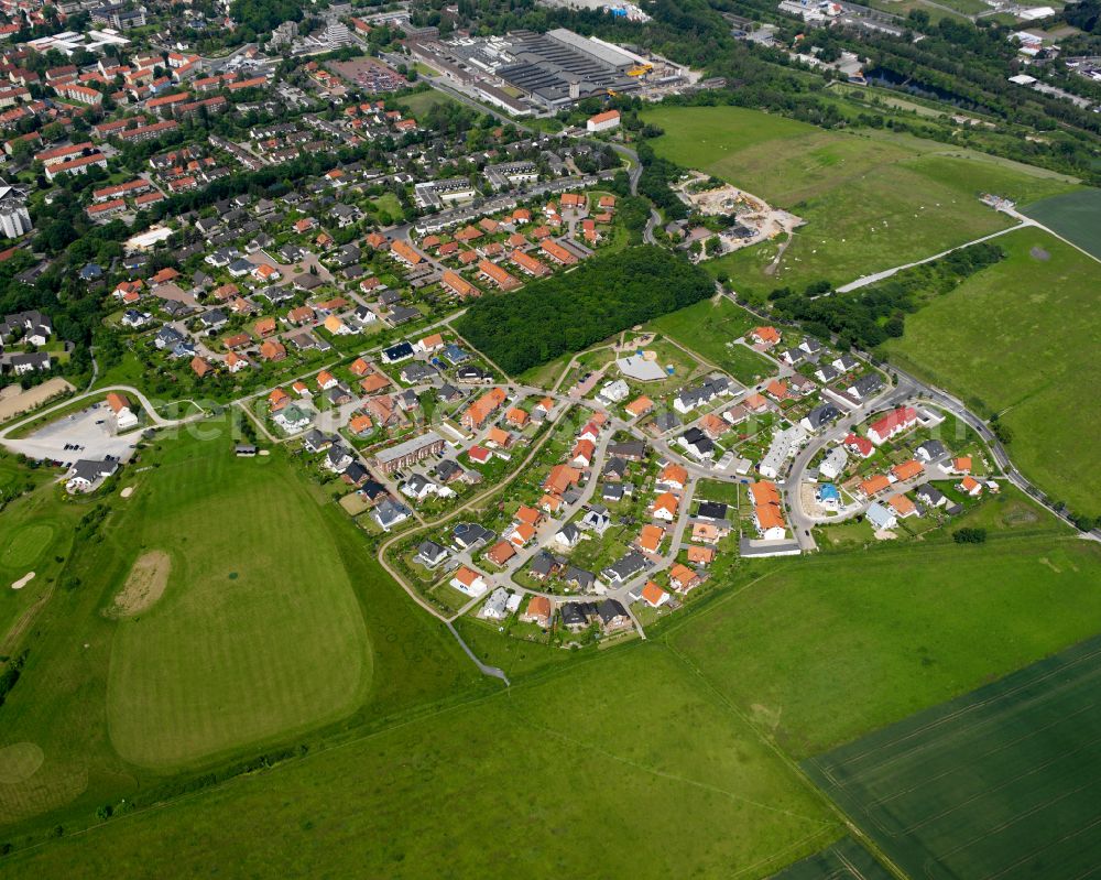 Bad from above - Surrounded by forest and forest areas center of the streets and houses and residential areas in Bad in the state Lower Saxony, Germany