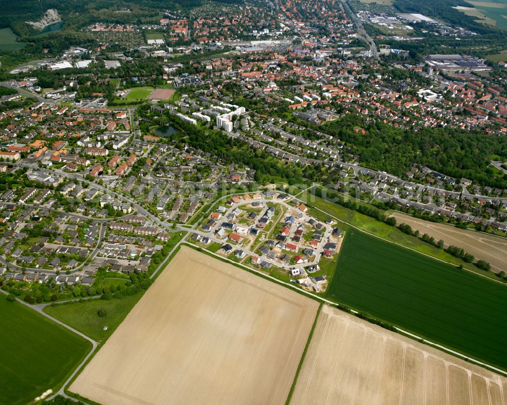 Bad from above - Surrounded by forest and forest areas center of the streets and houses and residential areas in Bad in the state Lower Saxony, Germany