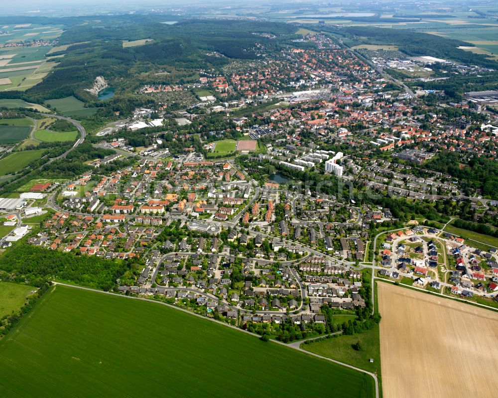 Bad from the bird's eye view: Surrounded by forest and forest areas center of the streets and houses and residential areas in Bad in the state Lower Saxony, Germany