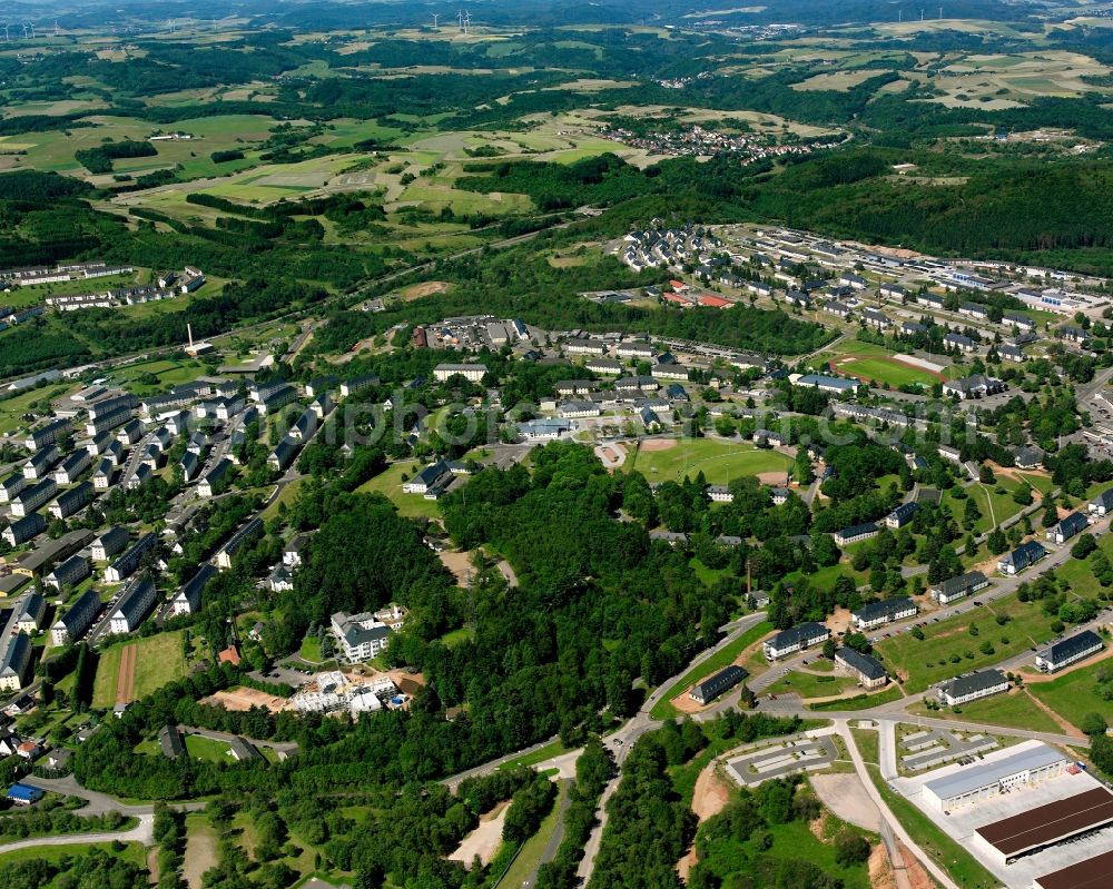 Baumholder from the bird's eye view: Surrounded by forest and forest areas center of the streets and houses and residential areas in Baumholder in the state Rhineland-Palatinate, Germany