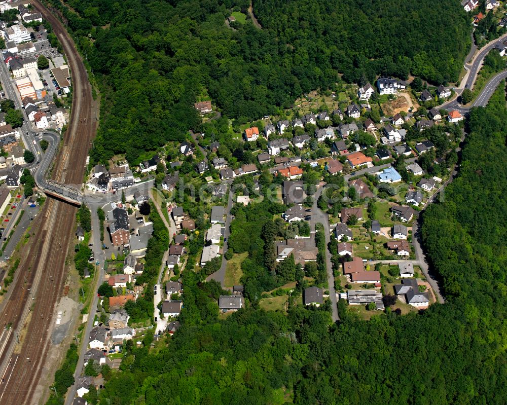 Dillenburg from the bird's eye view: Surrounded by forest and forest areas center of the streets and houses and residential areas in Dillenburg in the state Hesse, Germany