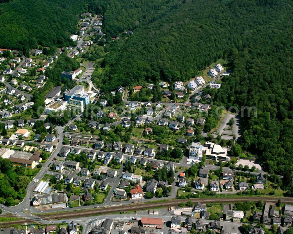 Aerial image Dillenburg - Surrounded by forest and forest areas center of the streets and houses and residential areas in Dillenburg in the state Hesse, Germany