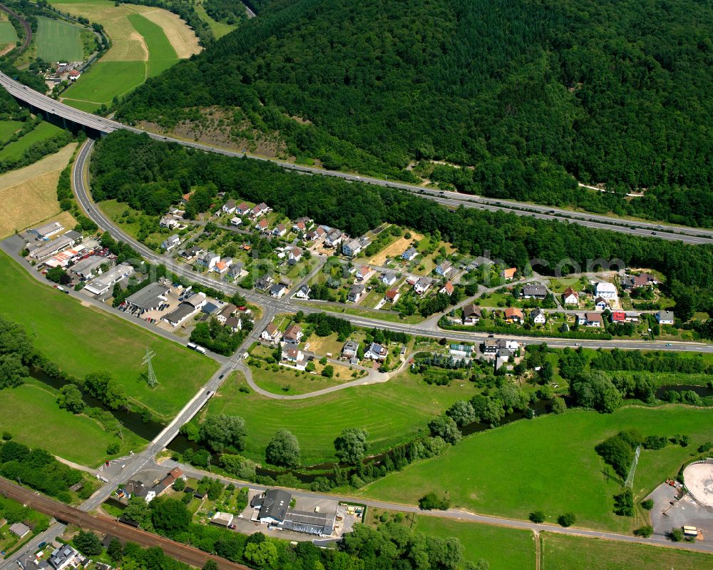 Aerial image Edingen - Surrounded by forest and forest areas center of the streets and houses and residential areas in Edingen in the state Hesse, Germany