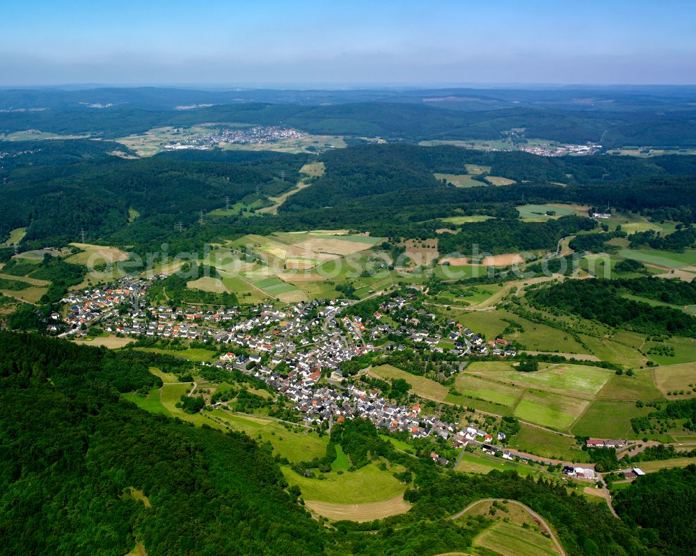 Aerial photograph Eibach - Surrounded by forest and forest areas center of the streets and houses and residential areas in Eibach in the state Hesse, Germany