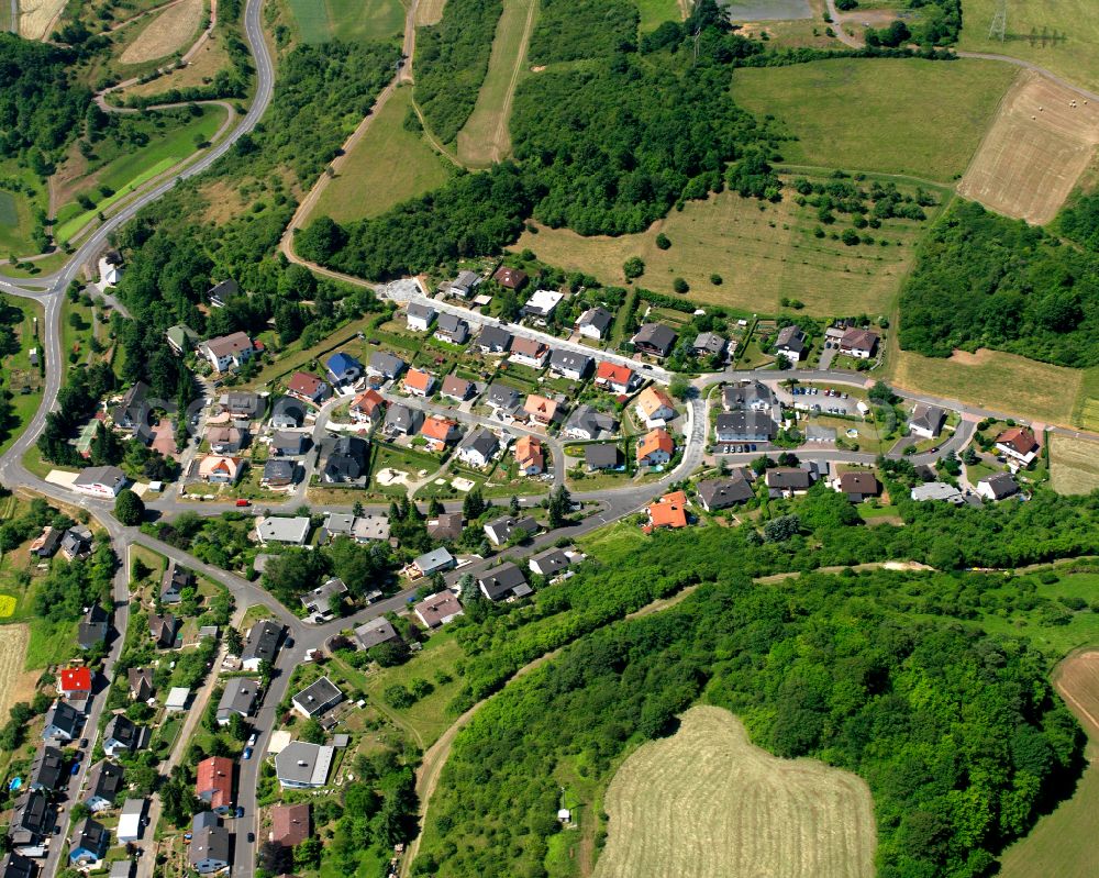 Eibach from above - Surrounded by forest and forest areas center of the streets and houses and residential areas in Eibach in the state Hesse, Germany