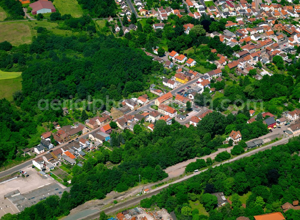 Eisenberg (Pfalz) from the bird's eye view: Surrounded by forest and forest areas center of the streets and houses and residential areas in Eisenberg (Pfalz) in the state Rhineland-Palatinate, Germany