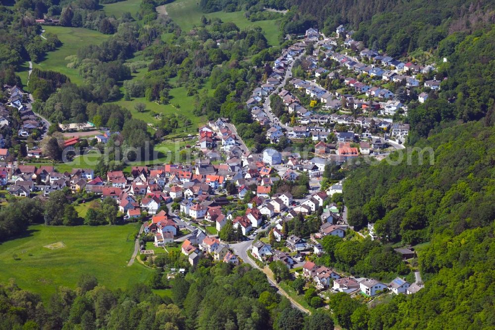 Aerial photograph Eppstein - Surrounded by forest and forest areas center of the streets and houses and residential areas in Eppstein in the state Hesse, Germany