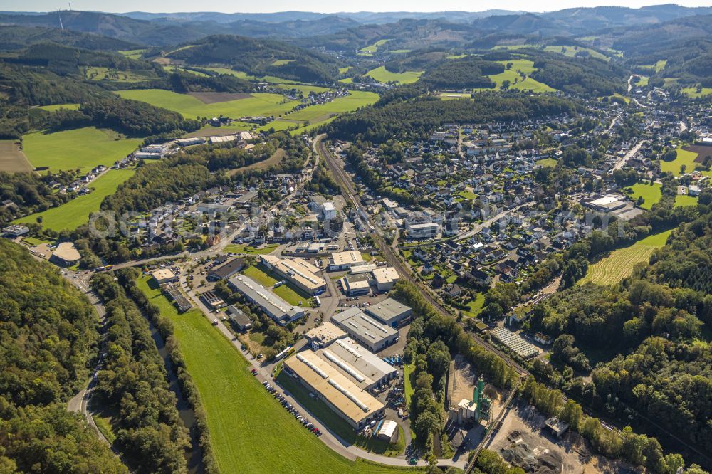 Aerial image Grevenbrück - Surrounded by forest and forest areas center of the streets and houses and residential areas in Grevenbrueck in the state North Rhine-Westphalia, Germany