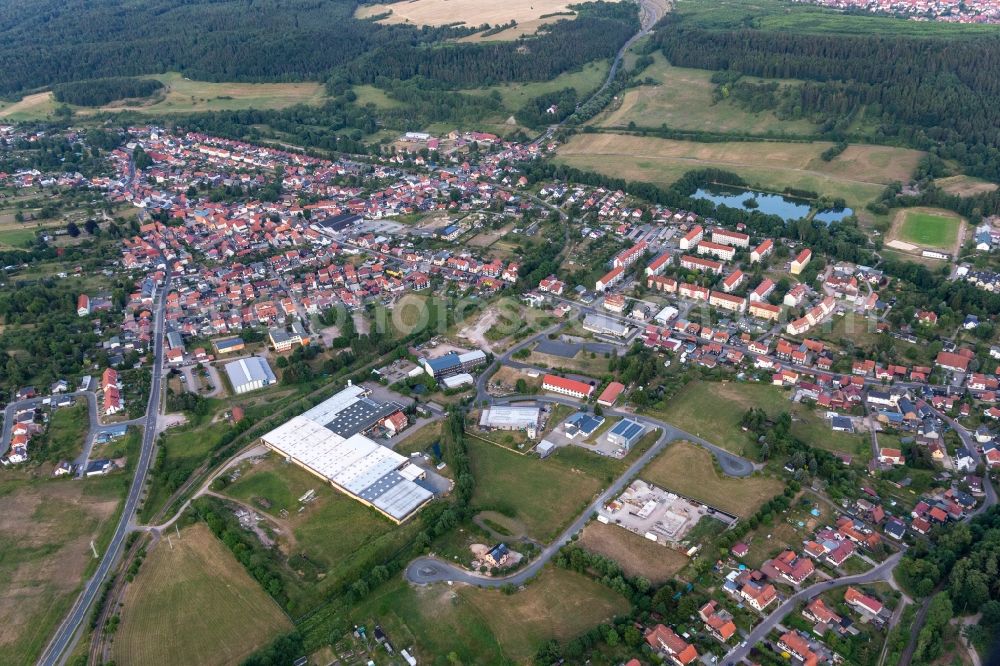 Gräfenroda from above - Surrounded by forest and forest areas center of the streets and houses and residential areas in Graefenroda in the state Thuringia, Germany