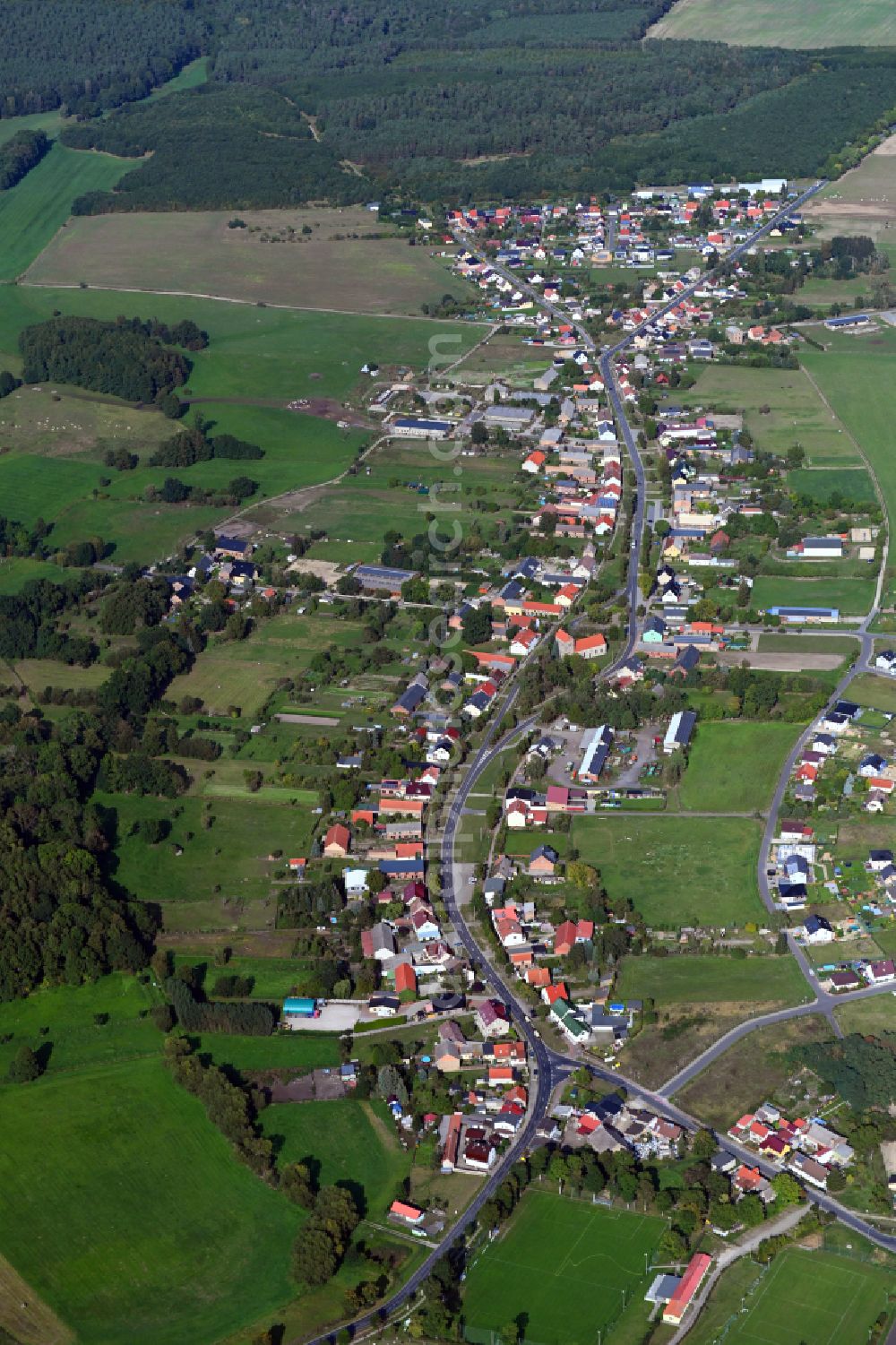 Grüneberg from above - Surrounded by forest and forest areas center of the streets and houses and residential areas in Grueneberg Loewenberger Land in the state Brandenburg, Germany