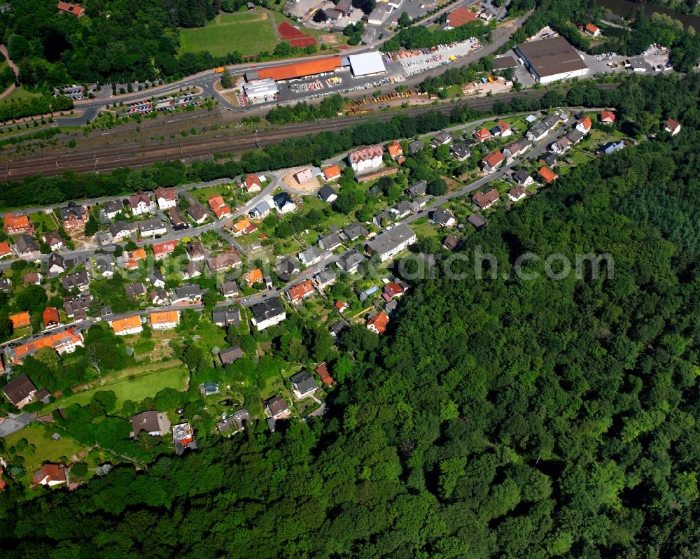 Hann. Münden from the bird's eye view: Surrounded by forest and forest areas center of the streets and houses and residential areas in Hann. Muenden in the state Lower Saxony, Germany