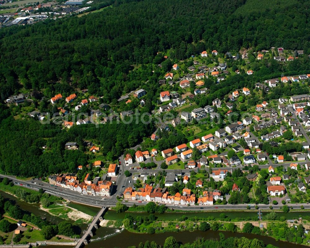 Hann. Münden from the bird's eye view: Surrounded by forest and forest areas center of the streets and houses and residential areas in Hann. Muenden in the state Lower Saxony, Germany