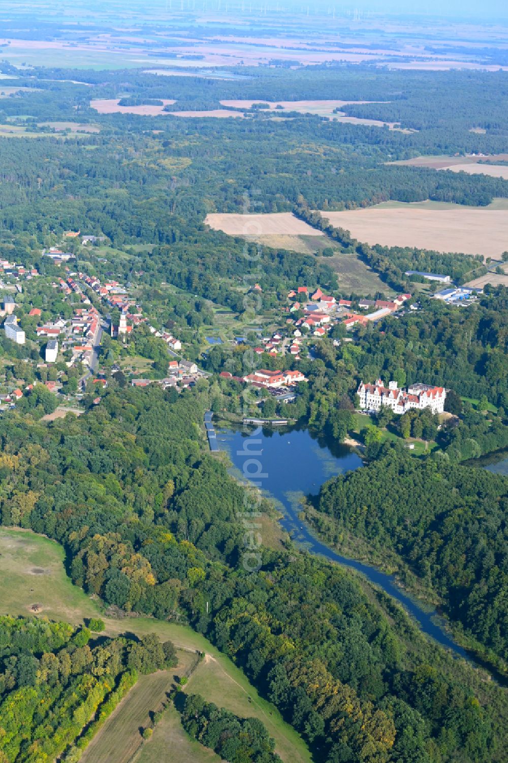 Aerial image Hardenbeck - Surrounded by forest and forest areas center of the streets and houses and residential areas in Hardenbeck in the state Brandenburg, Germany
