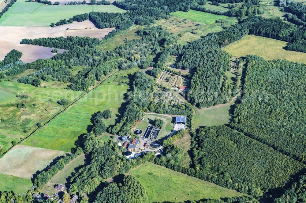 Harsefeld from above - Surrounded by forest and forest areas center of the streets and houses and residential areas in Harsefeld Ehrenberg in the state Lower Saxony, Germany