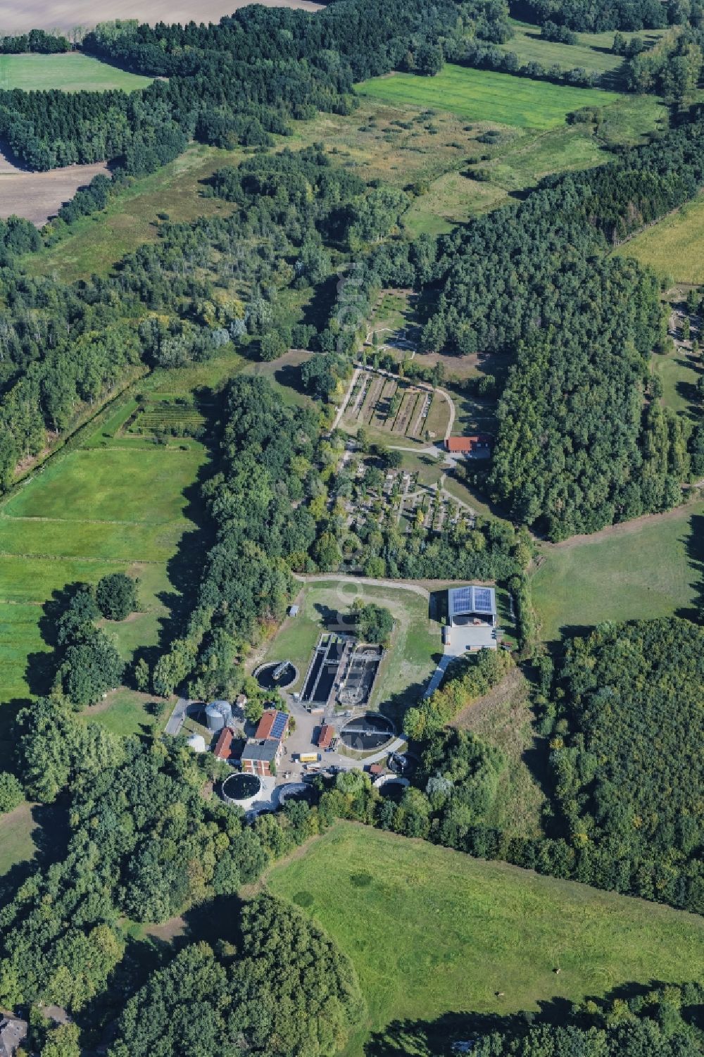 Harsefeld from the bird's eye view: Surrounded by forest and forest areas center of the streets and houses and residential areas in Harsefeld Ehrenberg in the state Lower Saxony, Germany