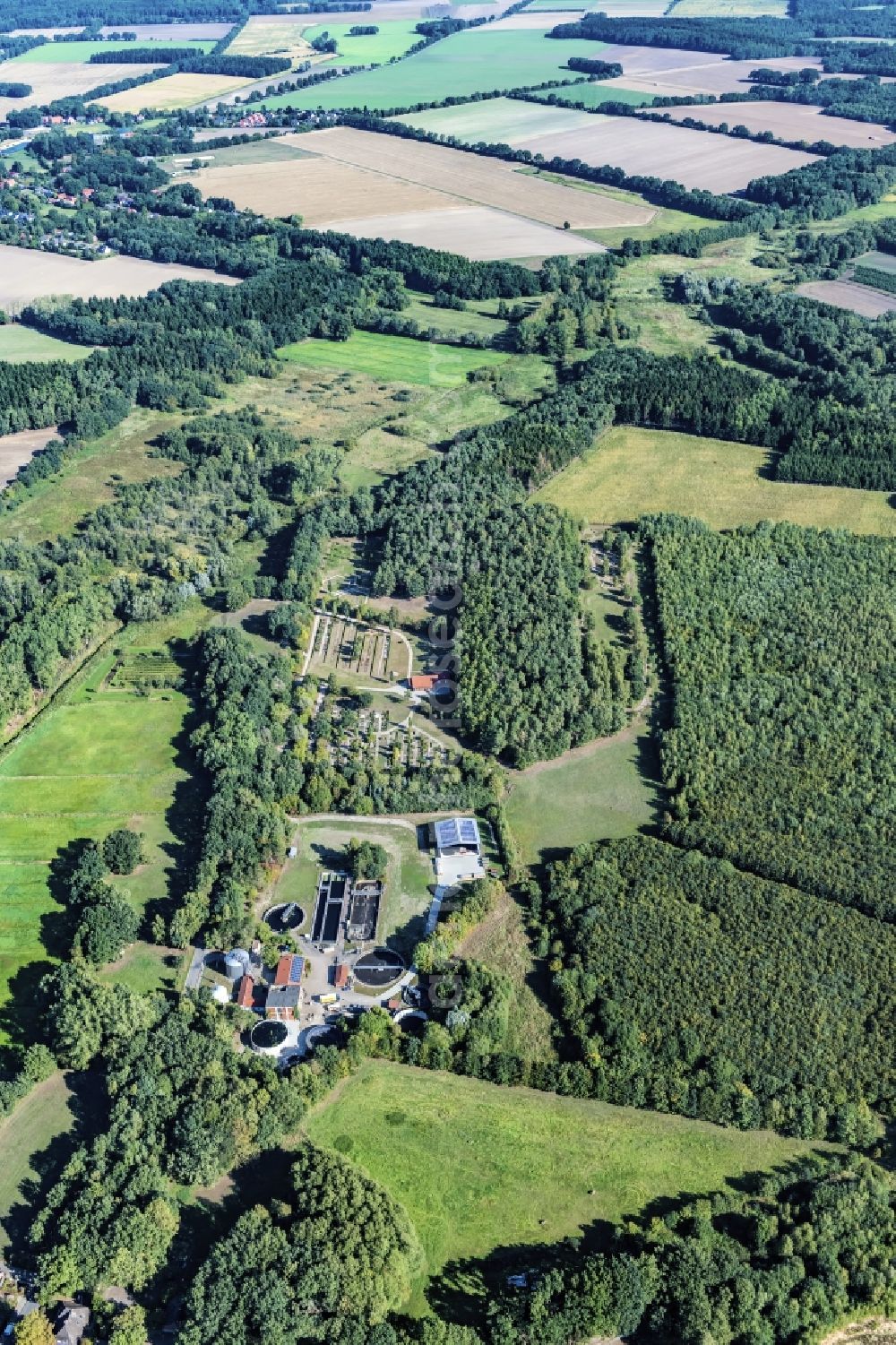 Aerial photograph Harsefeld - Surrounded by forest and forest areas center of the streets and houses and residential areas in Harsefeld Ehrenberg in the state Lower Saxony, Germany