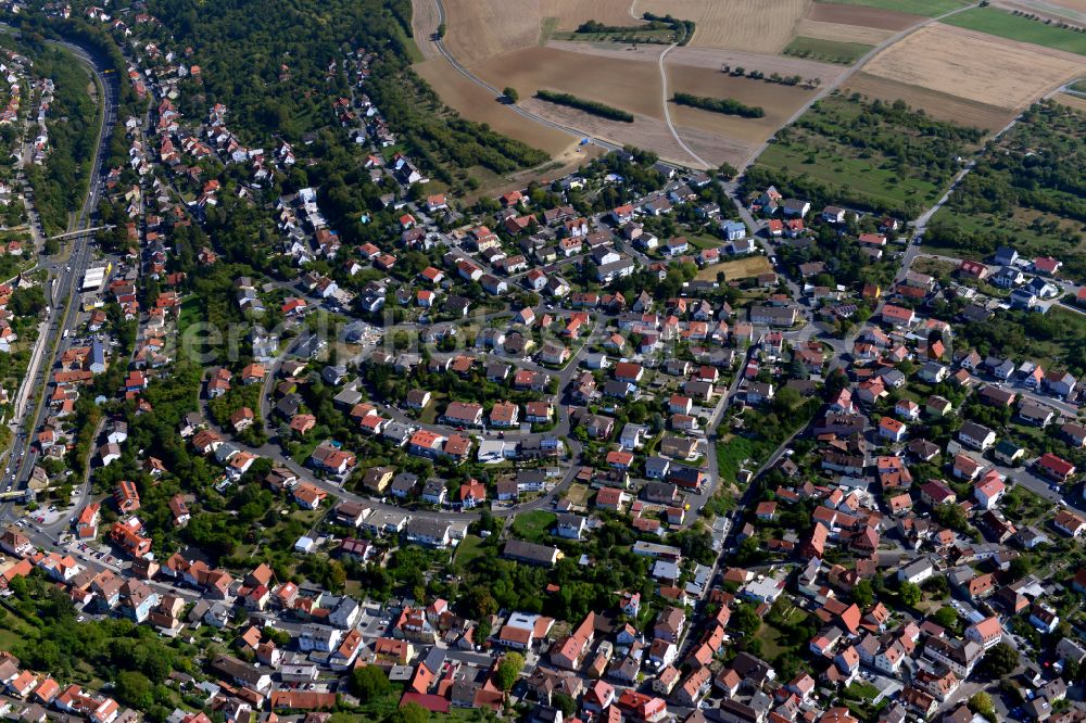 Aerial photograph Hexenbruch - Surrounded by forest and forest areas center of the streets and houses and residential areas in Hexenbruch in the state Bavaria, Germany