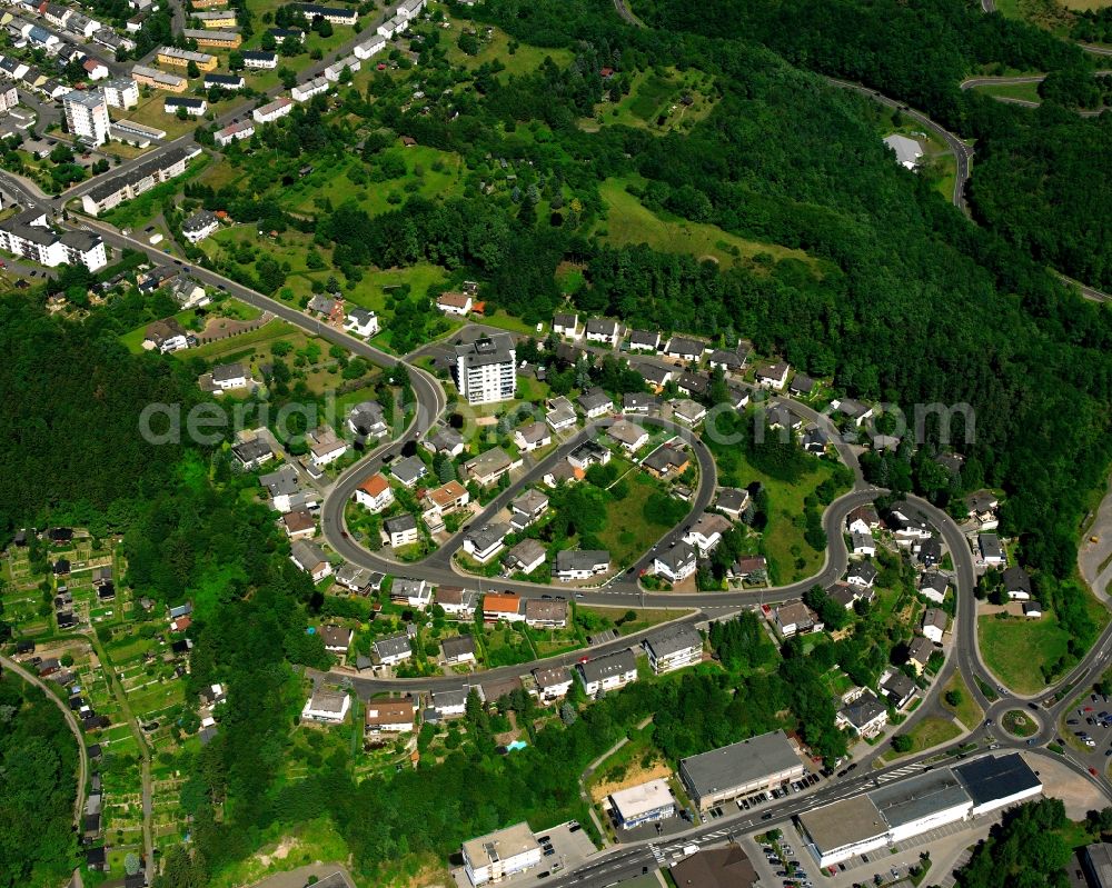 Idar from the bird's eye view: Surrounded by forest and forest areas center of the streets and houses and residential areas in Idar in the state Rhineland-Palatinate, Germany