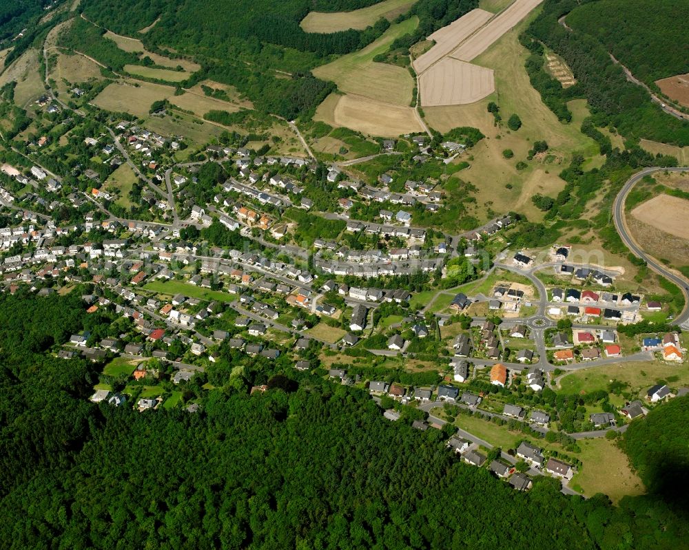 Aerial image Karlshof - Surrounded by forest and forest areas center of the streets and houses and residential areas in Karlshof in the state Rhineland-Palatinate, Germany