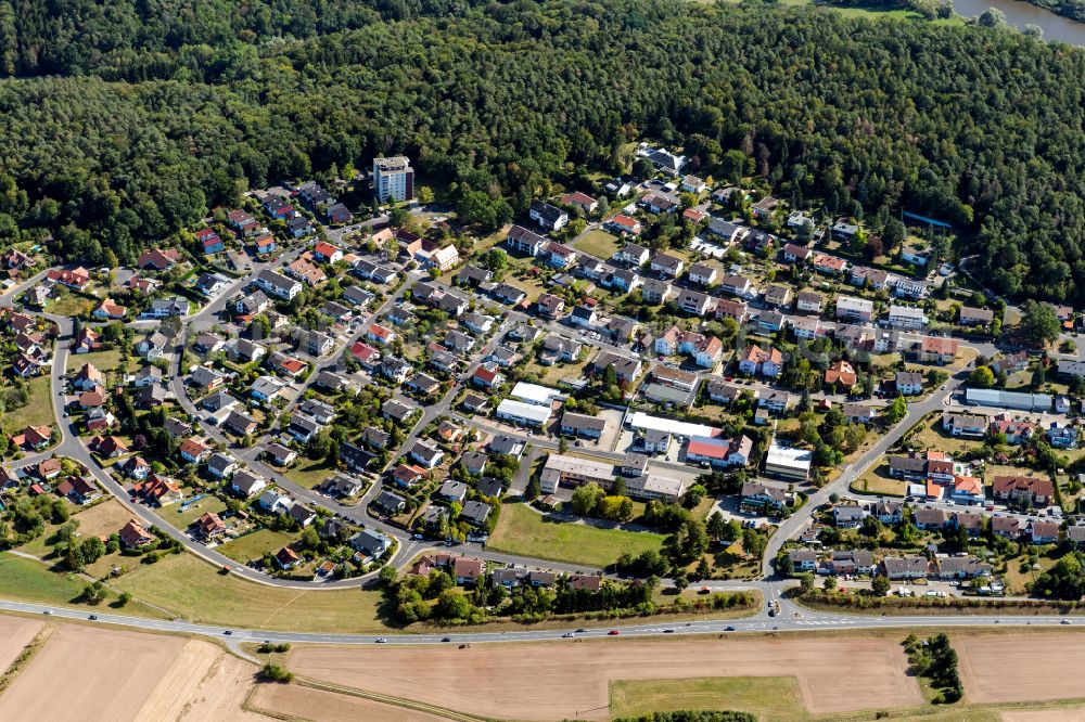 Kreuzwertheim from the bird's eye view: Surrounded by forest and forest areas center of the streets and houses and residential areas in Kreuzwertheim in the state Bavaria, Germany